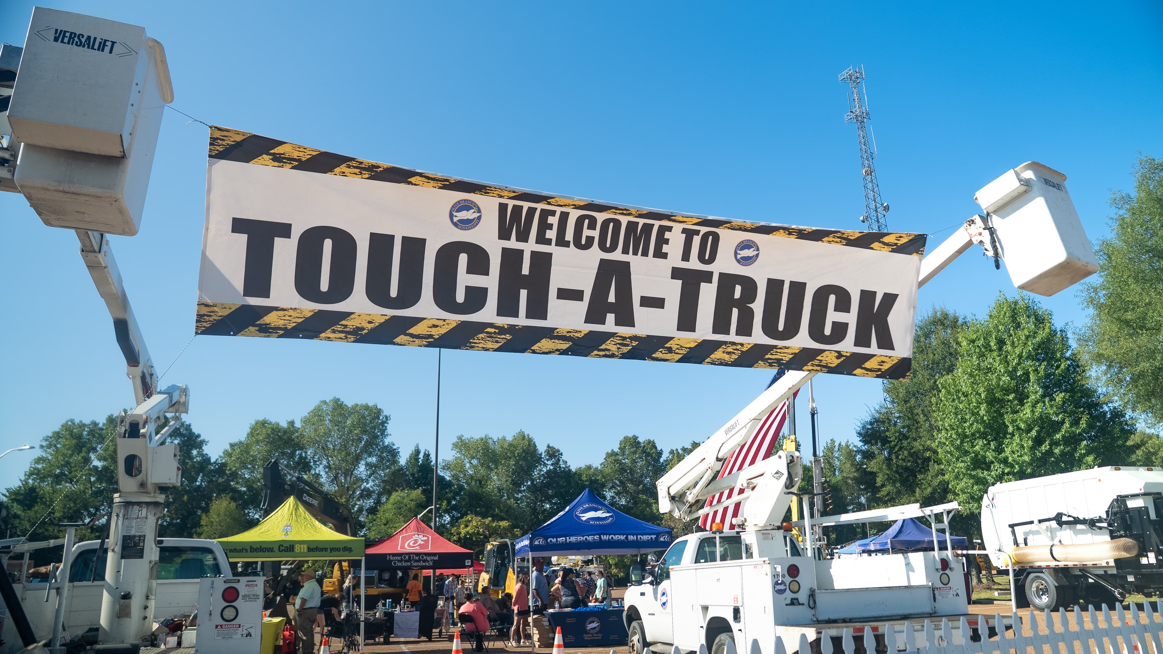 Families exploring trucks at Touch-a-Truck in Olive Branch