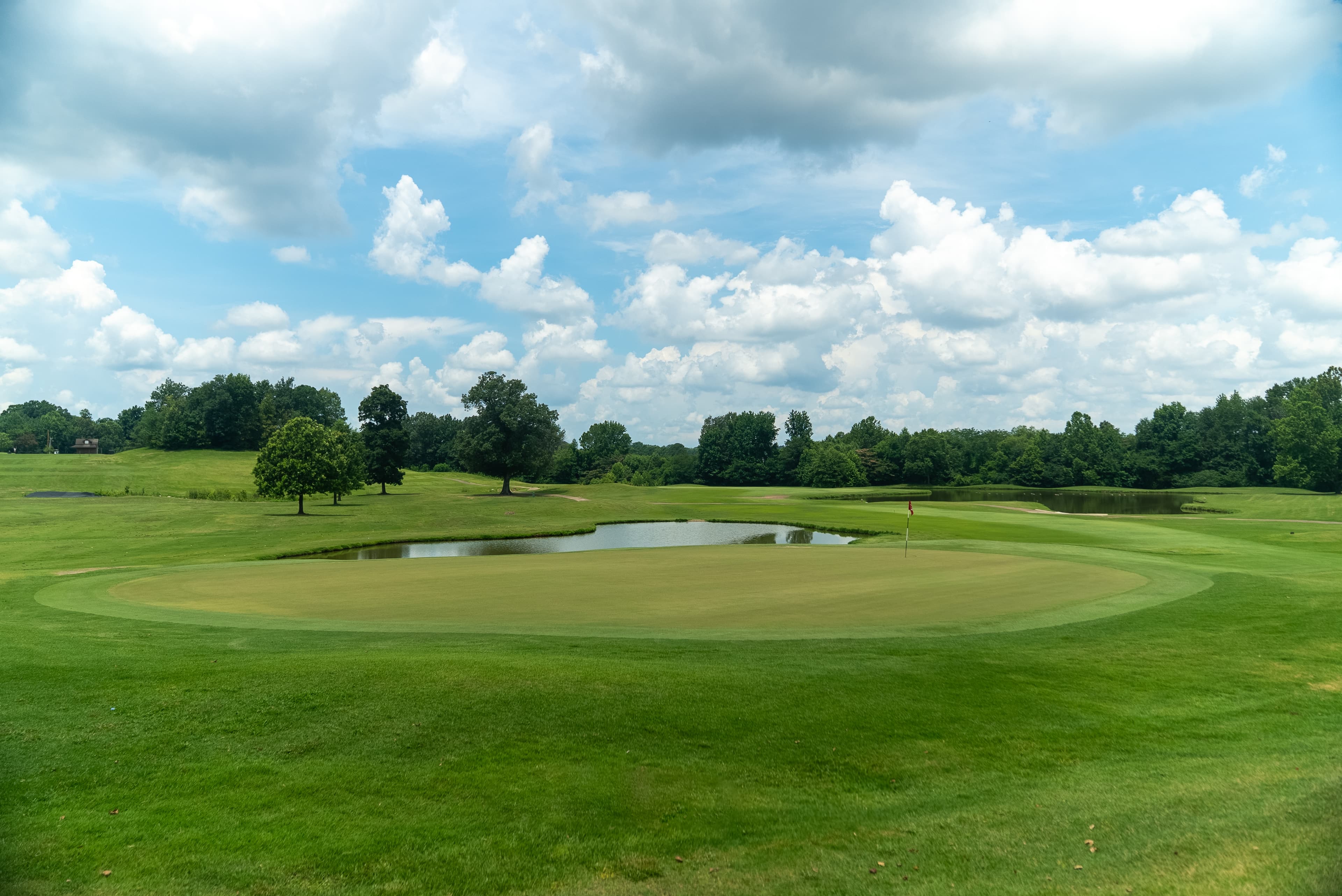 Fairway and clubhouse at Cherokee Valley Golf Club in Olive Branch