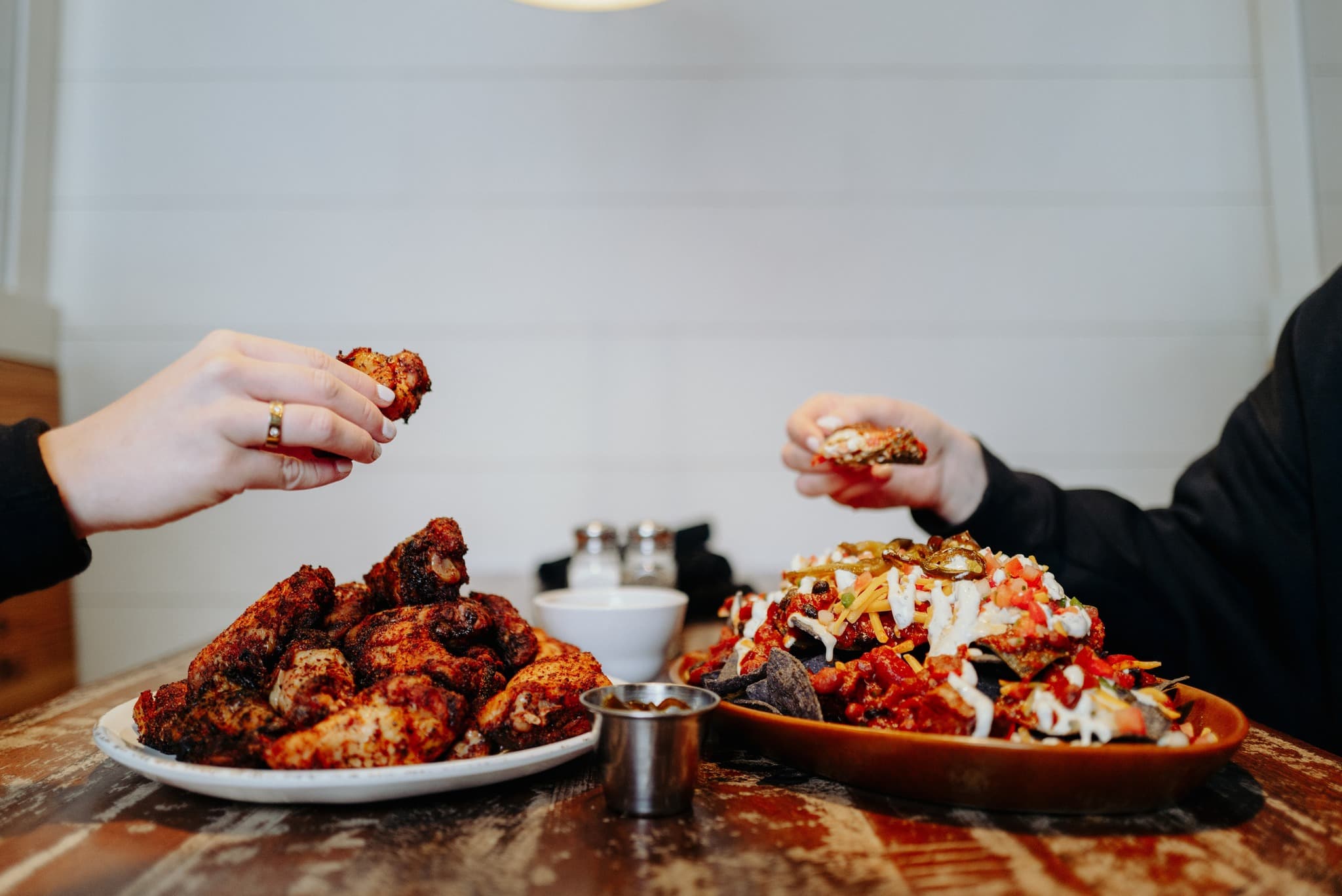 Wings and loaded nachos served at Wolf River Brisket