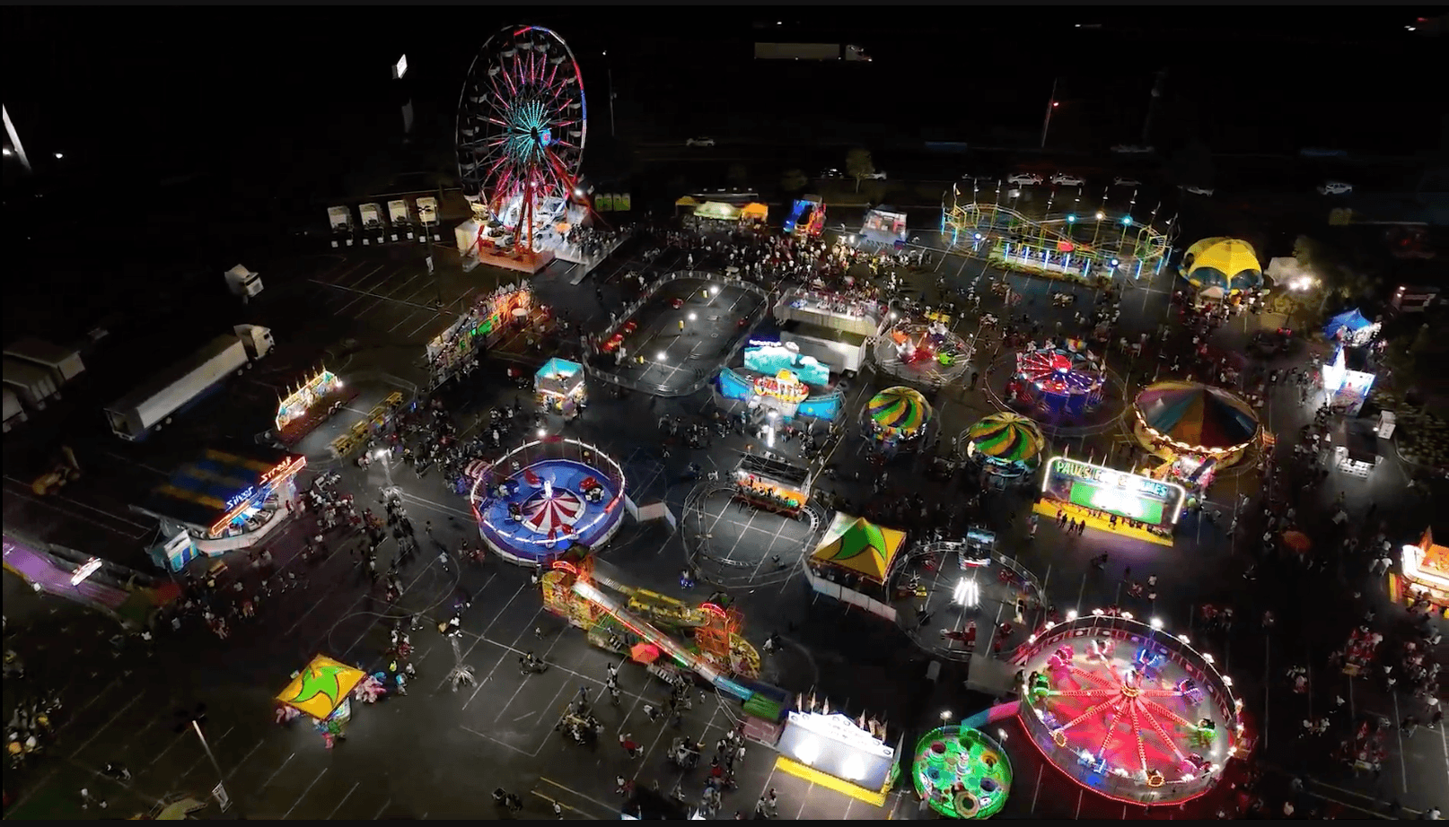 Mid-South Fair carnival lights and crowds at Snowden Grove in Southaven